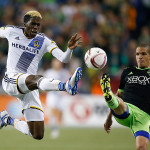 Los Angeles Galaxy forward Gyasi Zardes (11) jumps for the ball with Seattle Sounders FC midfielder Osvaldo Alonso (6) during the second half at CenturyLink Field. Seattle tied Los Angeles 1-1.