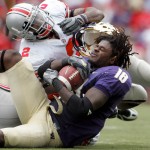 Ohio State UniversityÕs Malcolm Jenkins (2) rips Washington wide receiver Corey Williams’ (18) helmet off in the third quarter of a college football game Sept. 15, 2007 at Husky Stadium in Seattle, Wash.  Ohio State scored two unanswered touchdowns in the third quarter and beat the Huskies 33-14.