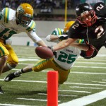 Archbishop Murphy High School running back Alex Kramer (2) can’t quite make it into the end zone as he is pushed out at the one-yard-line by Tumwater High SchoolÕs Jamison Dowers (25) and Kyle Warner (13) during the Washington 2A State Championship game Dec. 4, 2010 in Tacoma, Wash.