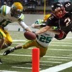 Archbishop Murphy High School running back Alex Kramer (2) can’t quite make it into the end zone as he is pushed out at the one-yard-line by Tumwater High SchoolÕs Jamison Dowers (25) and Kyle Warner (13) during the Washington 2A State Championship game Dec. 4, 2010 in Tacoma, Wash.