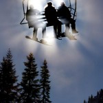 Snowboarders ride up the Hogsback chair during the opening day of operations at the Stevens Pass Ski Area December 28, 2004 in King County, Wash.